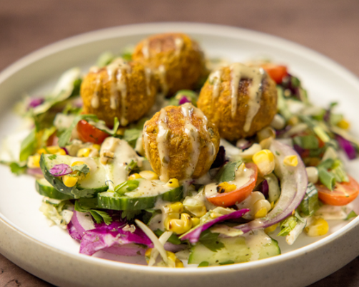https://eurestcafes.compass-usa.com/Skyview/PublishingImages/September26/Roasted%20Corn%20%26%20Cabbage%20Desi%20Salad%20with%20Chickpea%20Masala%20Balls.png